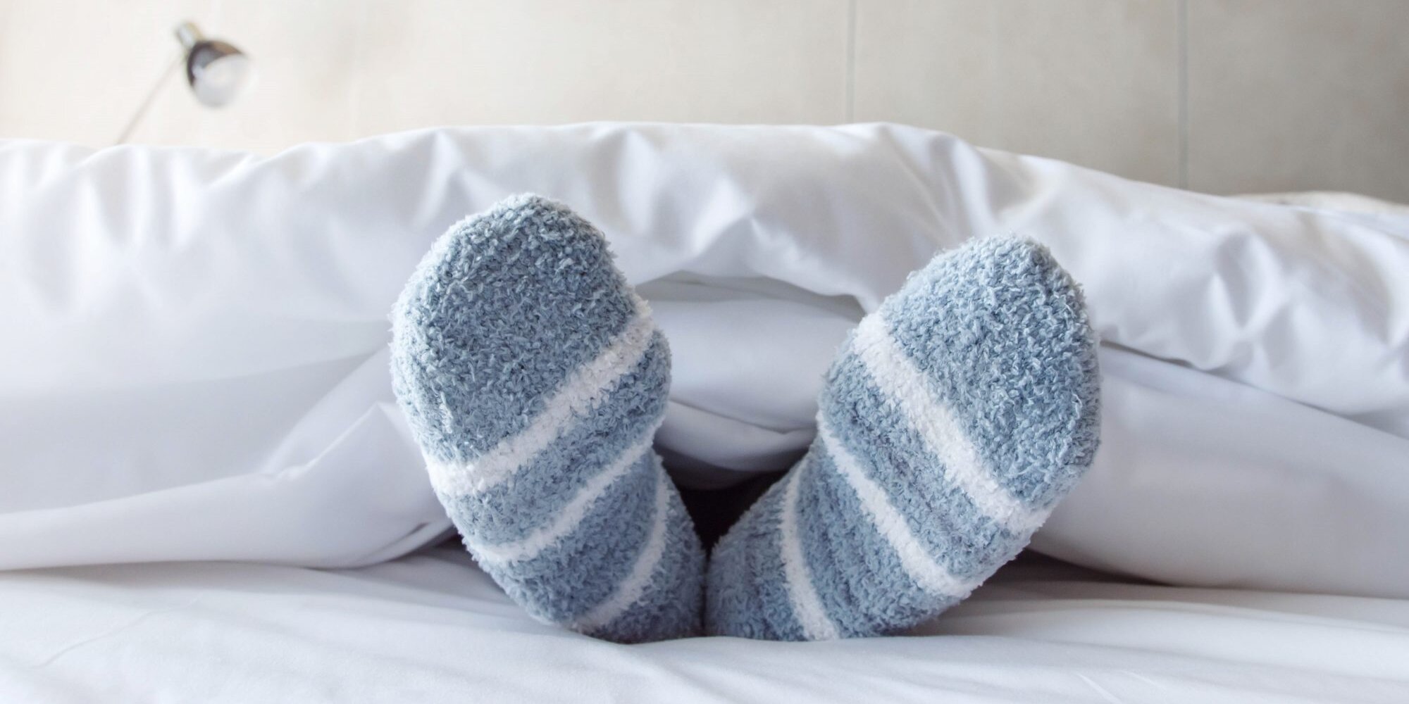 Wearing socks while sleeping.. What are the benefits and harms?, ArabiaWeather